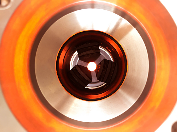 Top view of a soft-glass fiber preform while it is inside the furnace of a brand new 6-meter fiber fabrication draw tower facility (at DTU Fotonik)