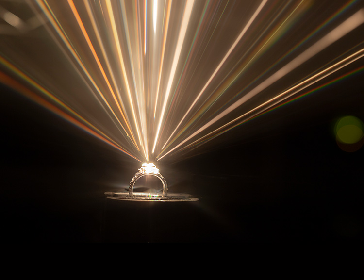 This image shows a number of optical phenomena, starting with a green laser (532-nm Nd:YAG) guided by a multimode silica optical fiber to a vial containing an organic dye