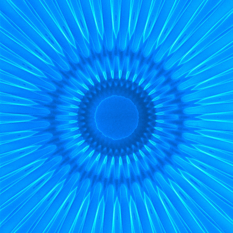 A multiplexing stream: The beams from three laser pointers of different wavelengths pass through a tank of water, and exit into a single water stream